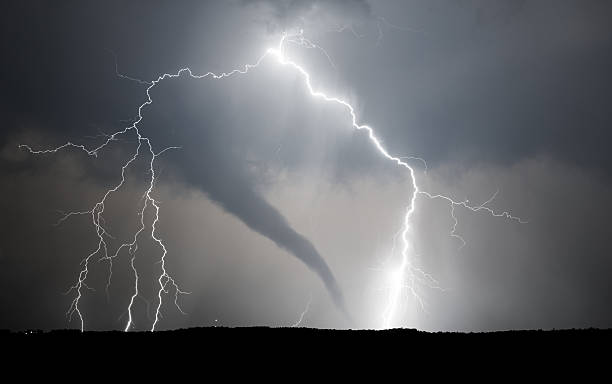 A powerful thunderstorm producing a tornado and lightning