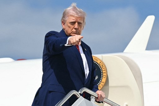 US president Donald Trump departs the White House