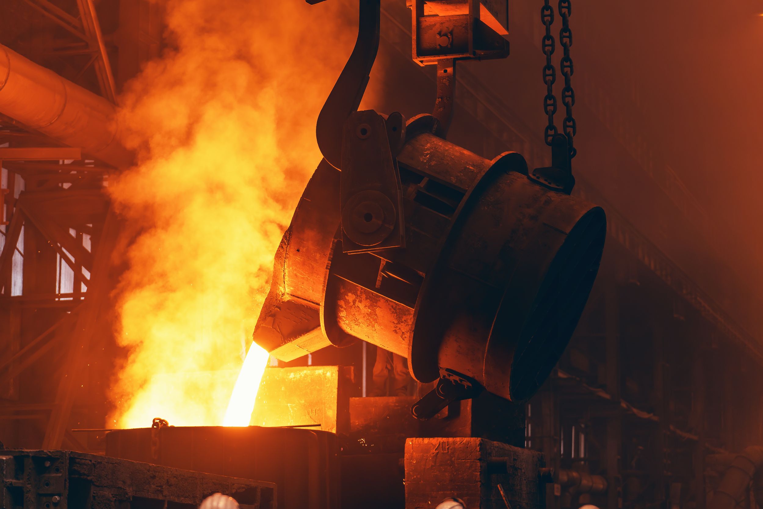 Molten,Metal,Pour,From,Big,Container,Into,Sand,Mold,With